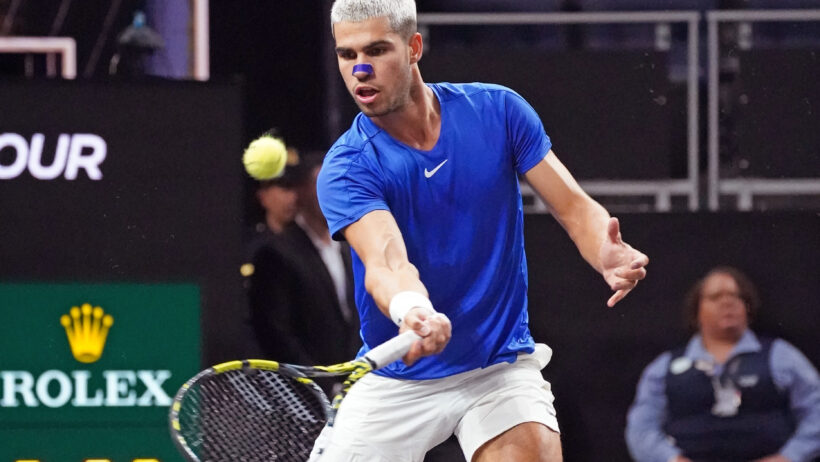 Carlos Alcaraz hits a volley during his Laver Cup match for Team Europe.