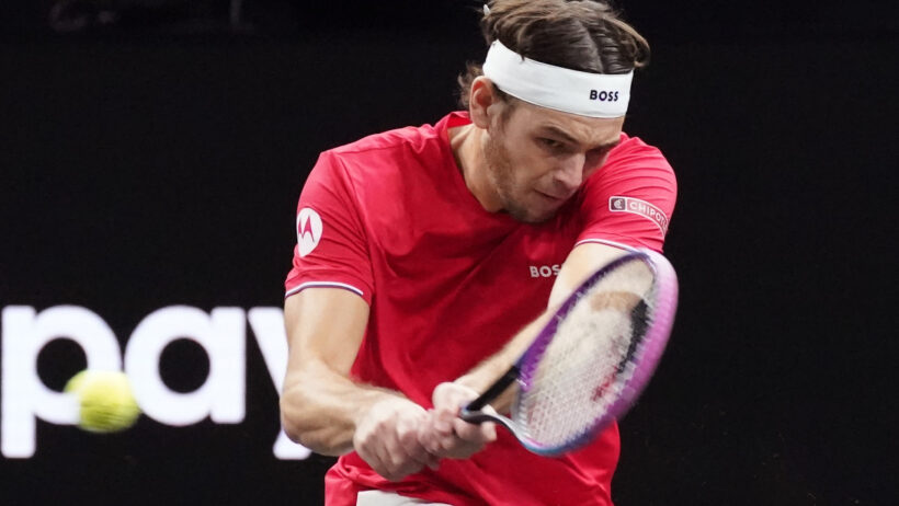 Taylor Fritz rips a two-handed backhander versus Alexander Zverev.