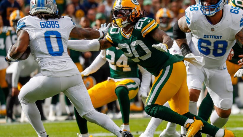 Detroit Lions running back Jahmyr Gibbs runs with the ball as Green Bay Packers safety Javon Bullard tries to make the tackle