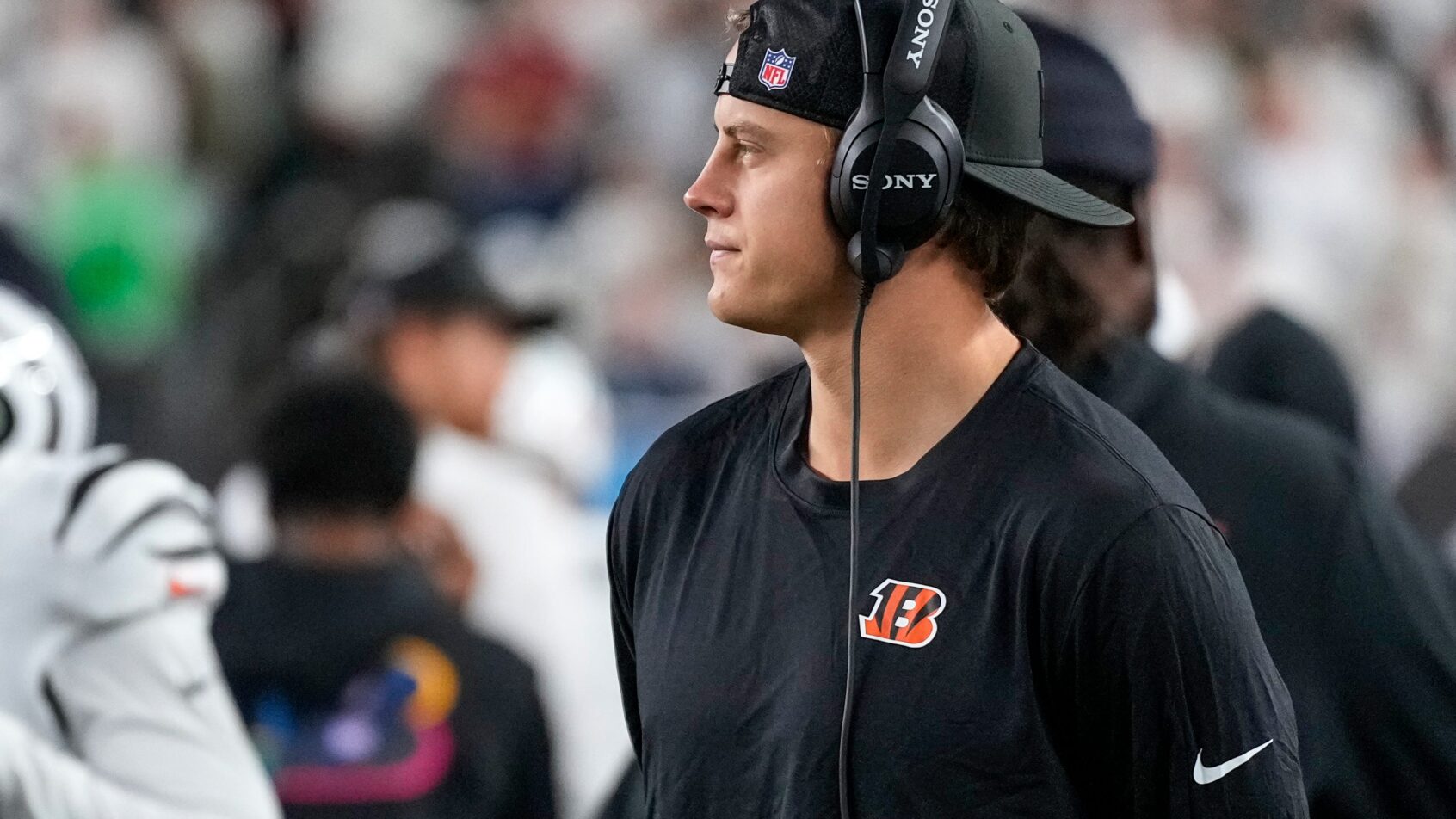 Joe Burrow on the sideline with a headset on
