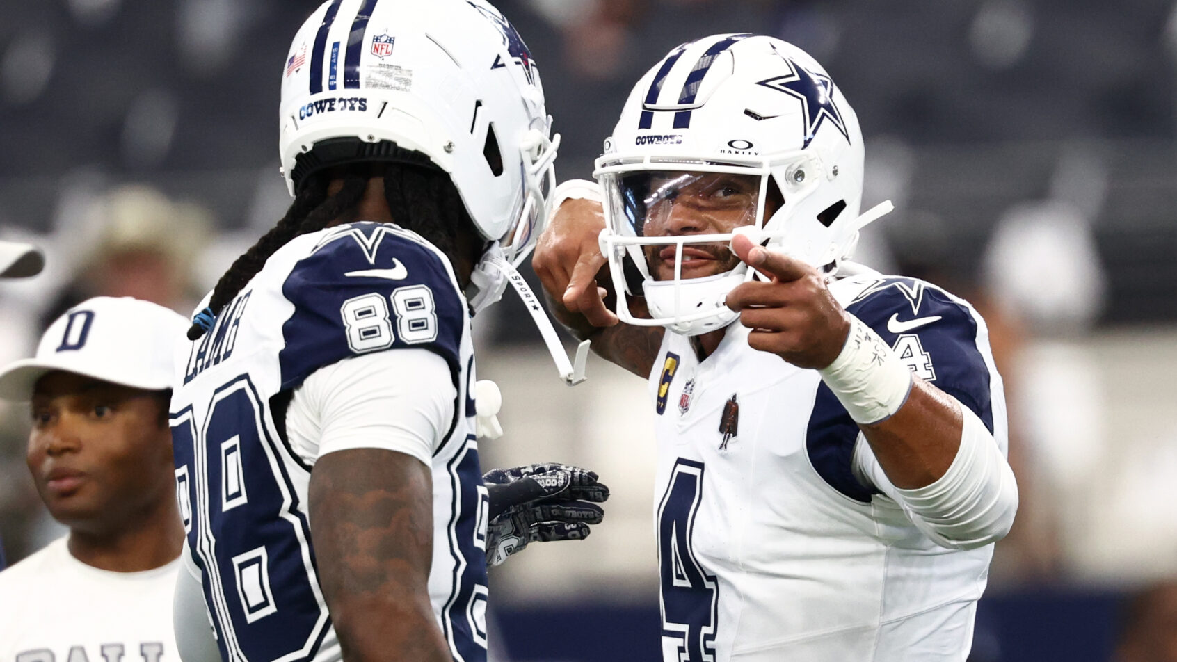 Dak Prescott and CeeDee Lamb celebrate prior to a game versus the Commanders.