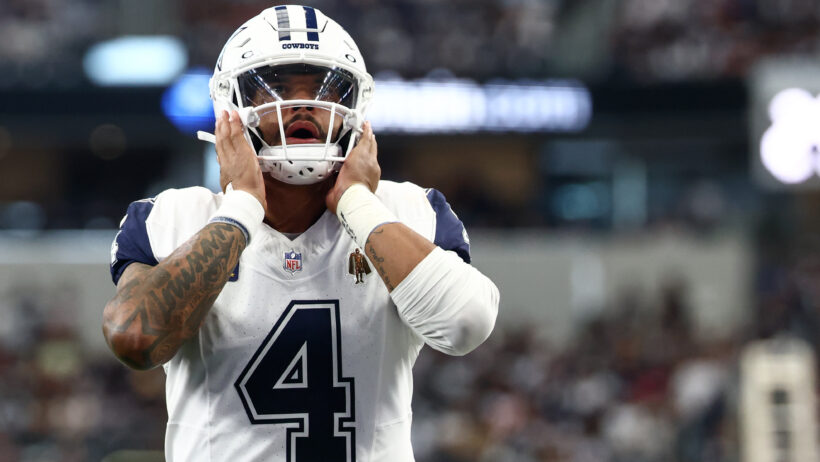 Dak Prescott holding helmet