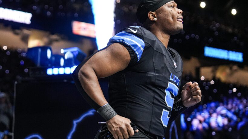 Detroit Lions running back David Montgomery jogging onto the field