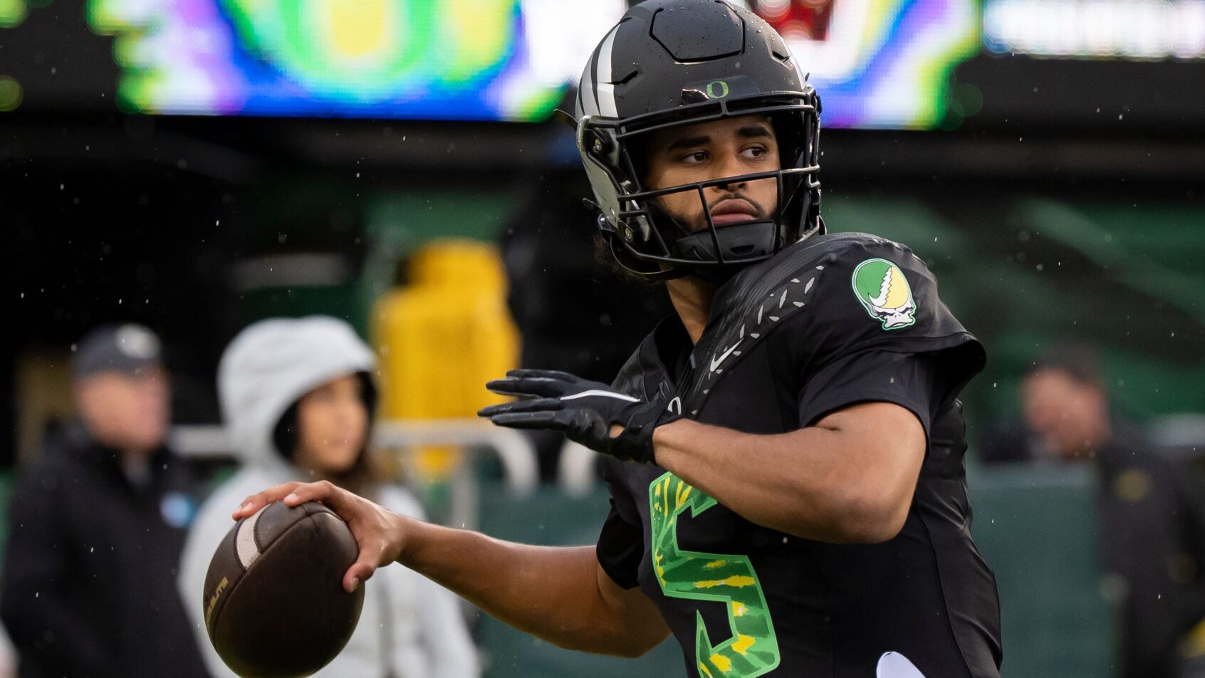 Oregon quarterback Dante Moore throws a pass