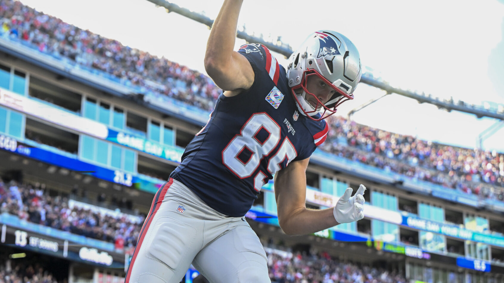 Hunter Henry spiking the ball after scoring a touchdown