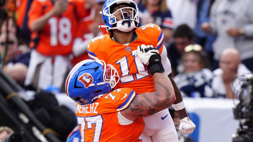 Troy Franklin celebrating after scoring a touchdown