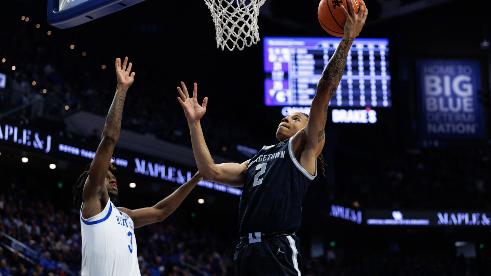 Malik Mack drives to the hoop versus Kentucky in an exhibition game.