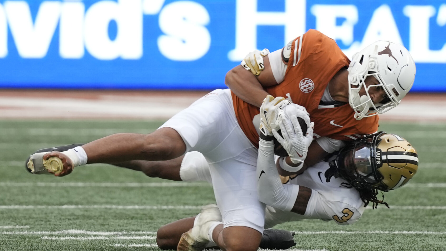 Texas Longhorns wide receiver Emmett Mosley V getting tackled against Vanderbilt