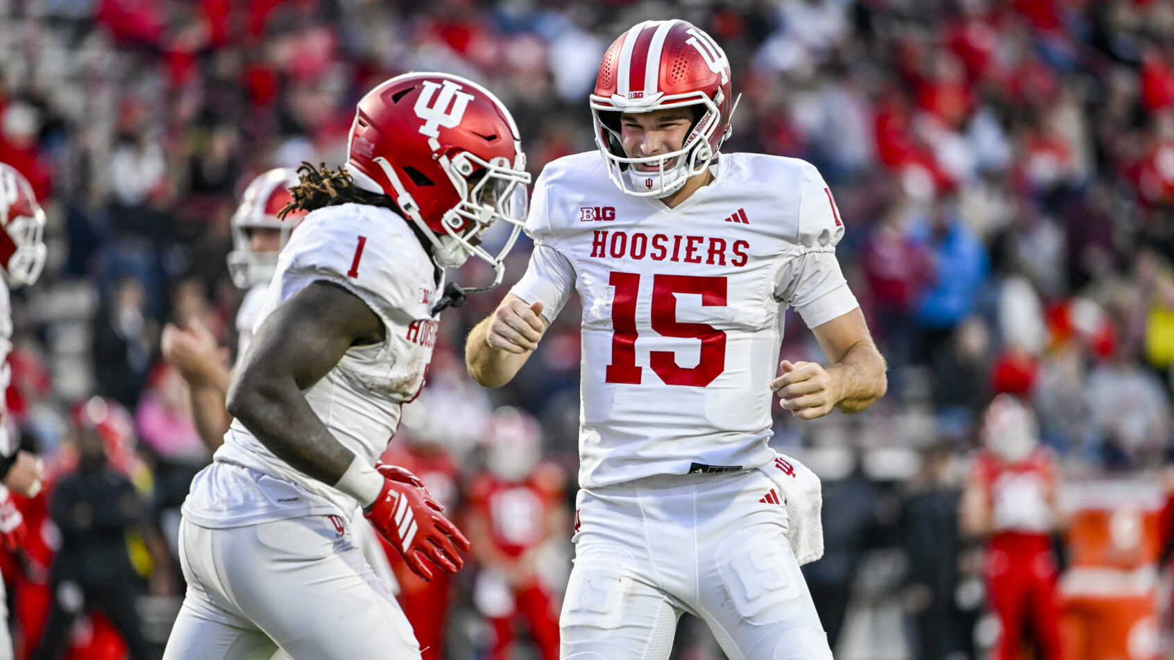 Fernando Mendoza celebrates with his teammate