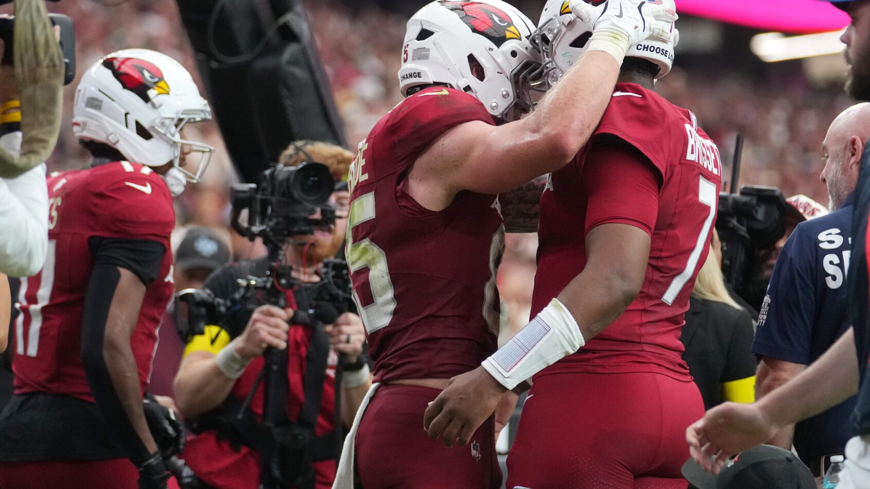 Trey McBride and Jacoby Brissett celebrating after a touchdown