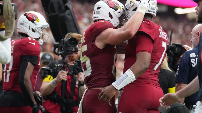 Trey McBride and Jacoby Brissett celebrating after a touchdown
