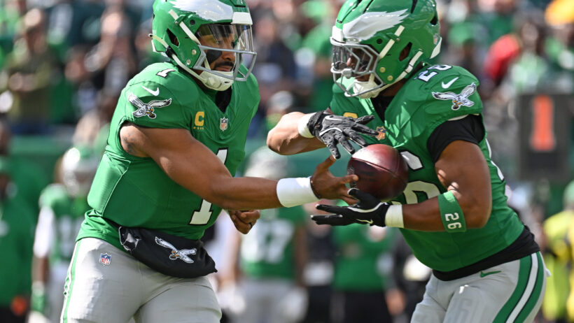 Jalen Hurts hands off to Saquon Barkley