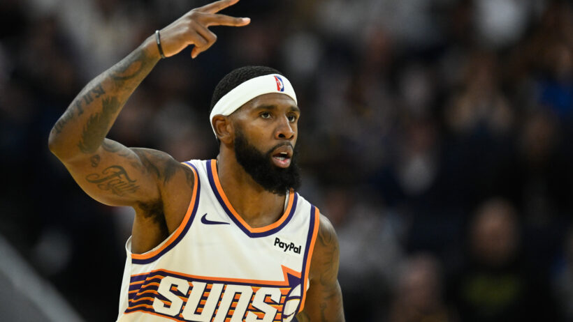 Phoenix Suns forward Royce O'Neale celebrates a three