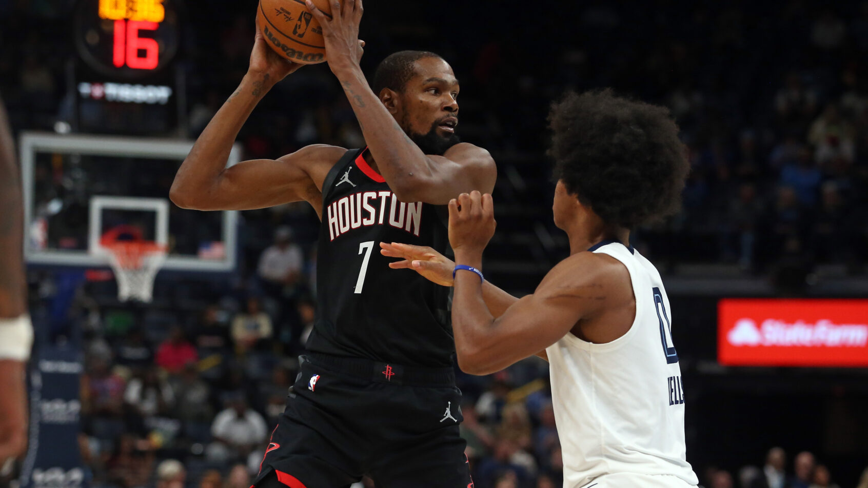 Houston Rockets forward Kevin Durant holds the ball as Memphis Grizzlies forward Jaylen Wells defends