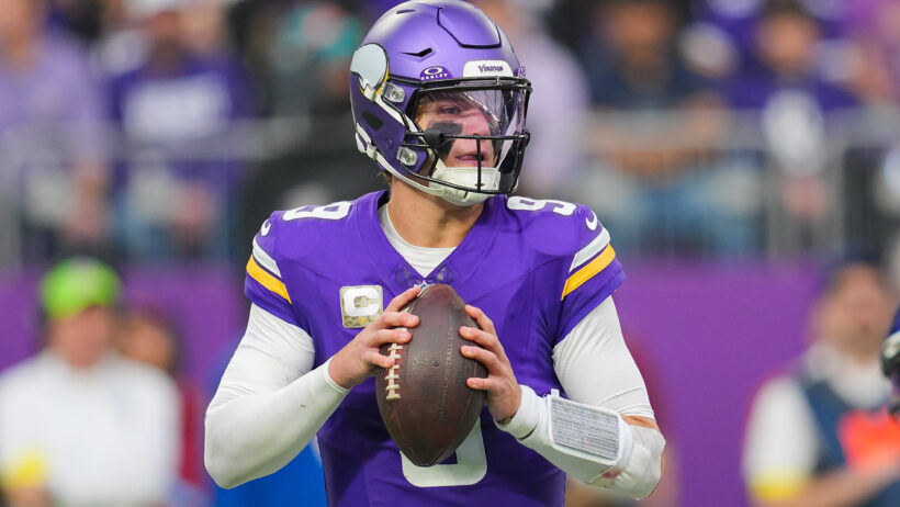 JJ McCarthy dropping back to pass