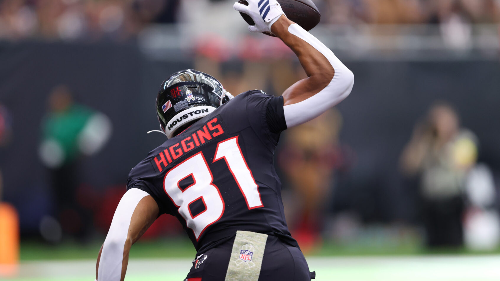 Jayden Higgins spiking the ball after a touchdown