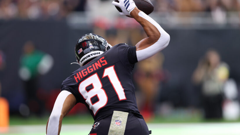Jayden Higgins spiking the ball after a touchdown