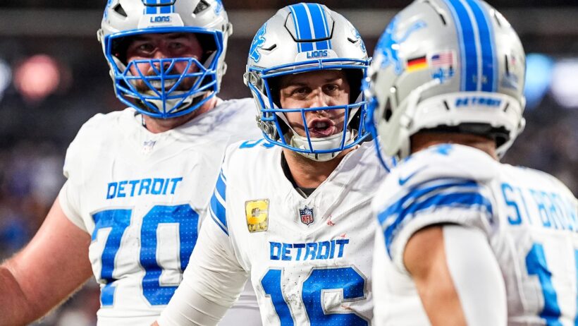 Detroit Lions quarterback Jared Goff and wide receiver Amon-Ra St. Brown celebrate a TD