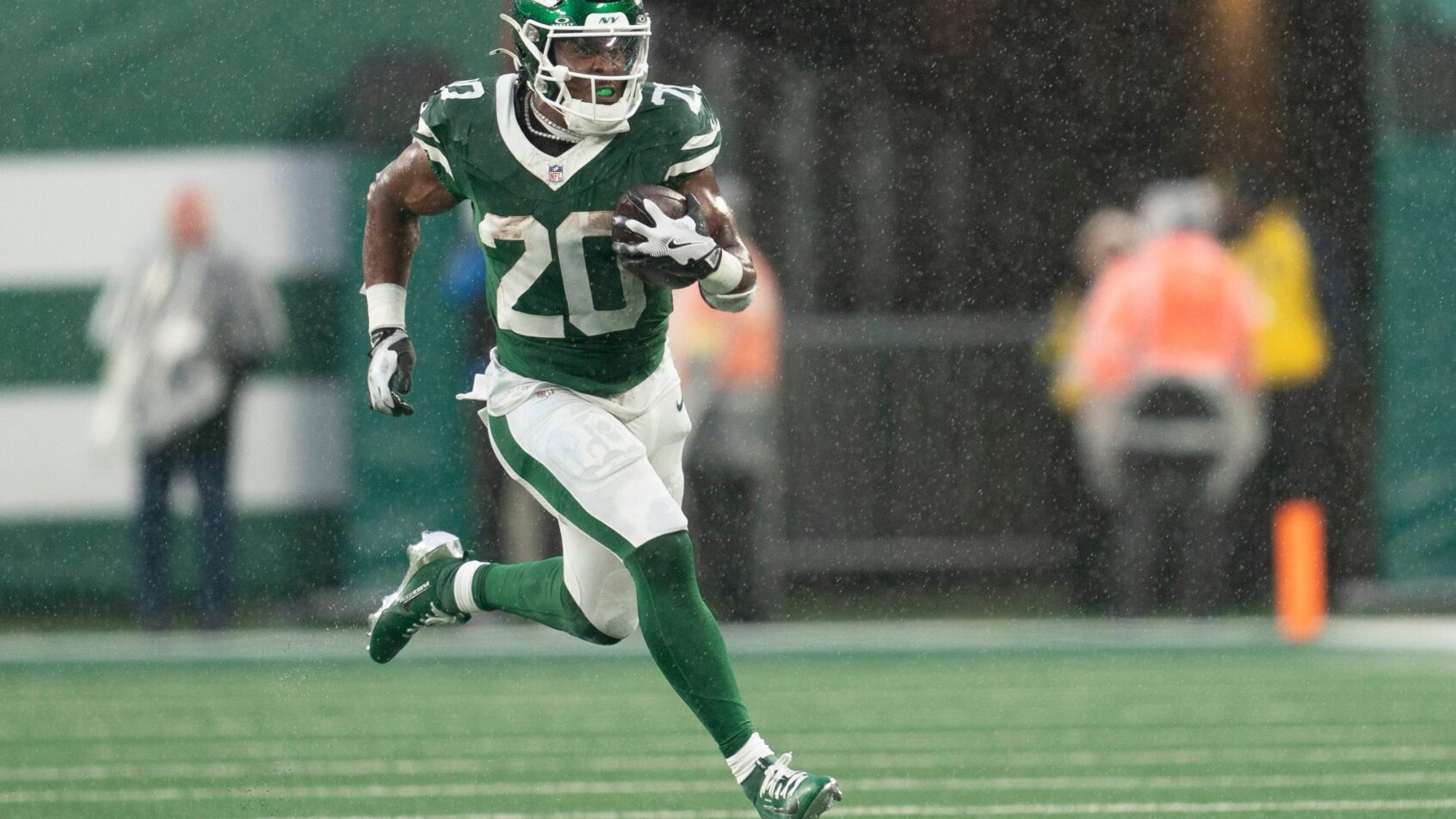 Breece Hall running the ball after a reception