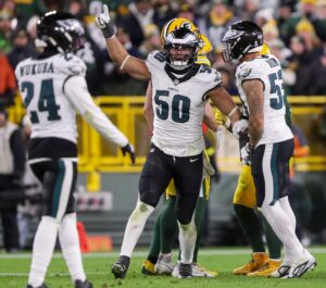 Jaelan Phillips celebrates an Eagles fumble recover in a game versus the Packers.