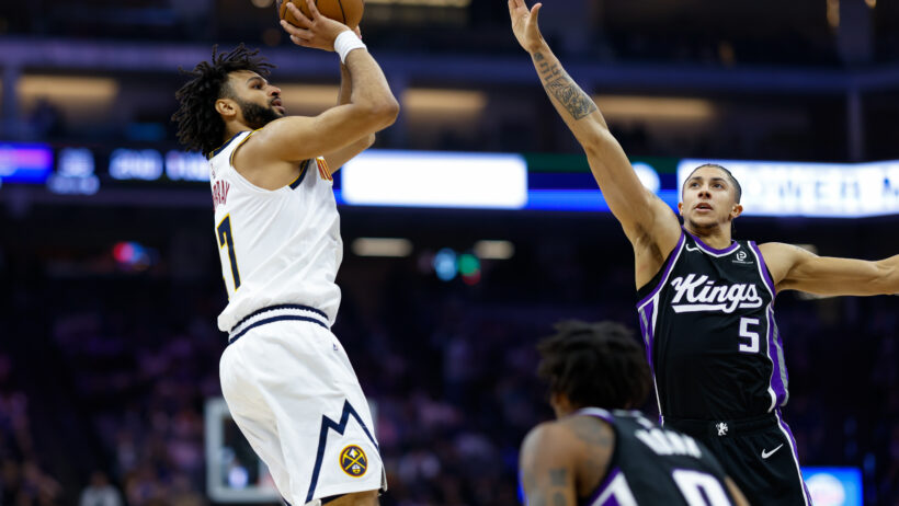 Denver Nuggets guard Jamal Murray shoots over Sacramento Kings guard Nique Clifford