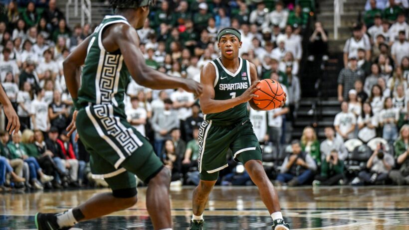 Michigan State's Jeremy Fears Jr passing to teammate Trey Fort