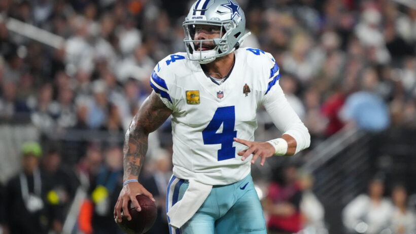 Dak Prescott looks for an open receiver vs the Raiders.