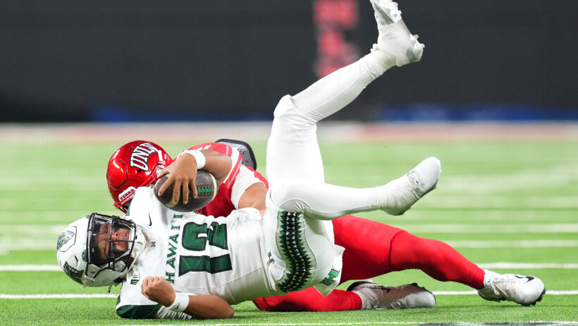 Micah Alejado getting tackled