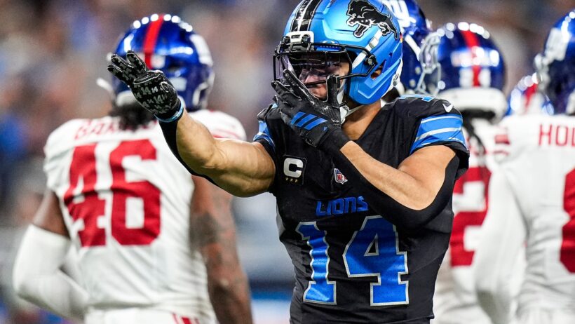 Amon-Ra St. Brown celebrates a first down catch versus the Giants.