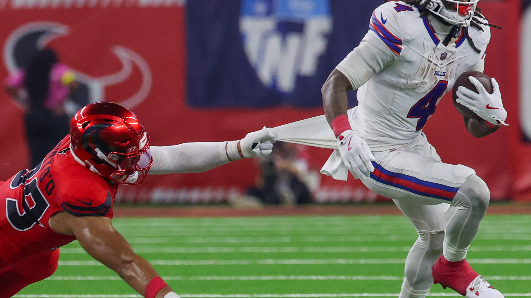 Buffalo Bills running back James Cook III escapes a tackle