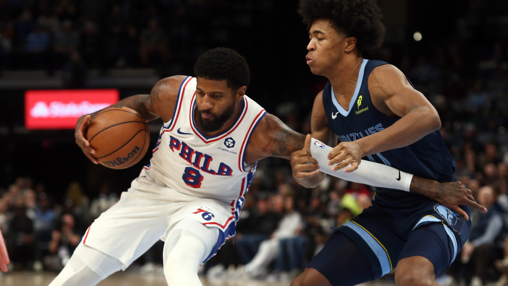 Philadelphia 76ers forward Paul George drives as Memphis Grizzlies forward Jaylen Wells defends