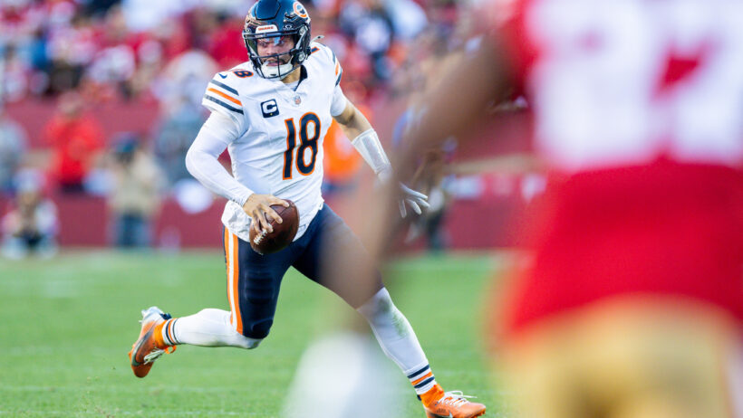 Chicago Bears quarterback Caleb Williams running with the ball against the San Francisco 49ers