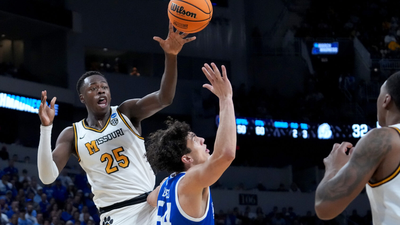 Missouri Tigers guard Mark Mitchell passing the ball