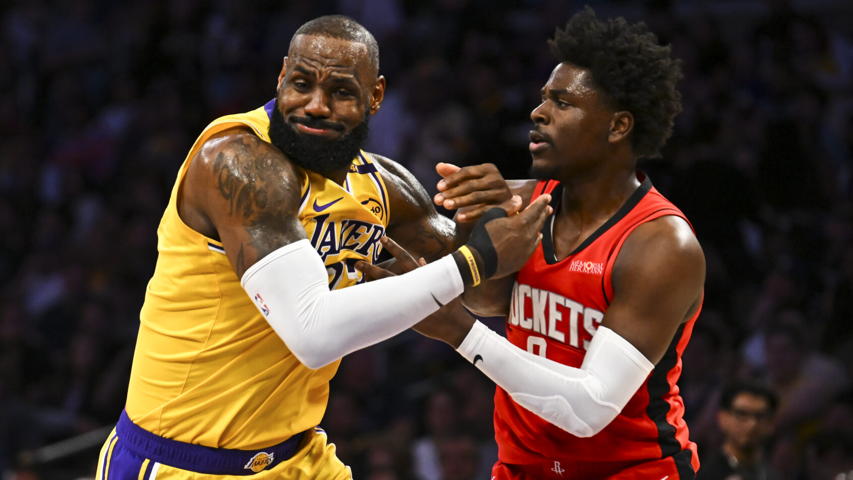 Houston Rockets guard Aaron Holiday guarding Los Angeles Lakers forward LeBron James