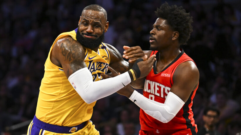 Houston Rockets guard Aaron Holiday guarding Los Angeles Lakers forward LeBron James
