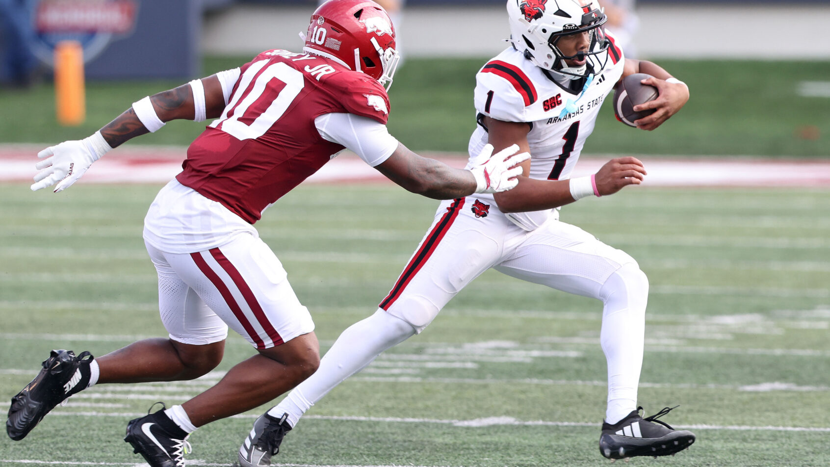 Arkansas State's Jaylen Raynor eludes a tackle versus Arkansas.