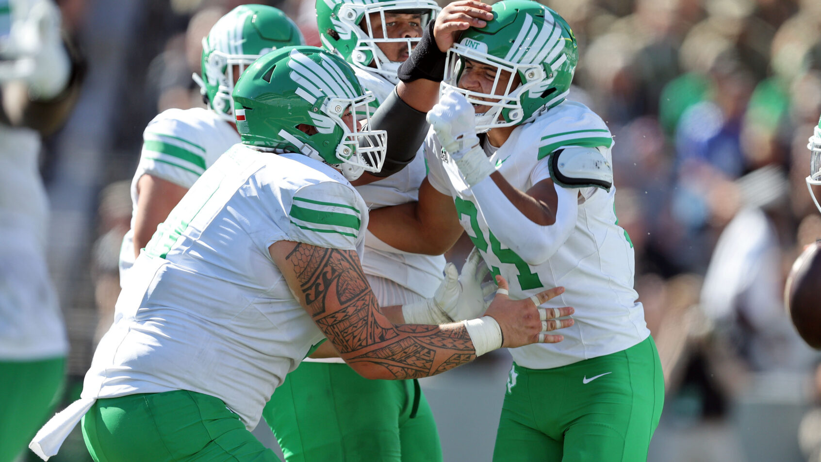 Caleb Hawkins celebrates a North Texas touchdown.