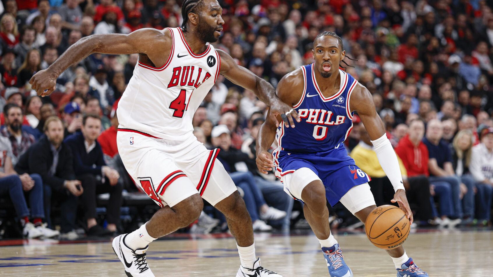 Philadelphia 76ers guard Tyrese Maxey dribbles as Chicago Bulls forward Patrick Williams defends