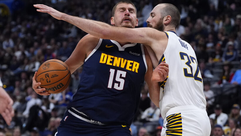 Indiana Pacers center Jay Huff defends against Denver Nuggets center Nikola Jokic