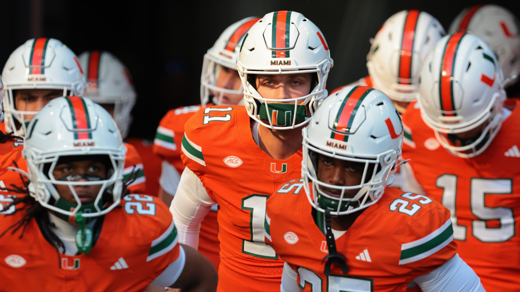 Carson Beck leads the Hurricanes onto the field.