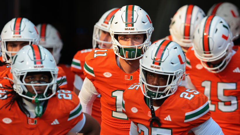 Carson Beck leads the Hurricanes onto the field.