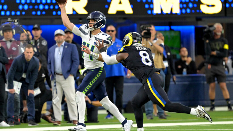 Seattle Seahawks quarterback Sam Darnold throwing on the run against the LA Rams