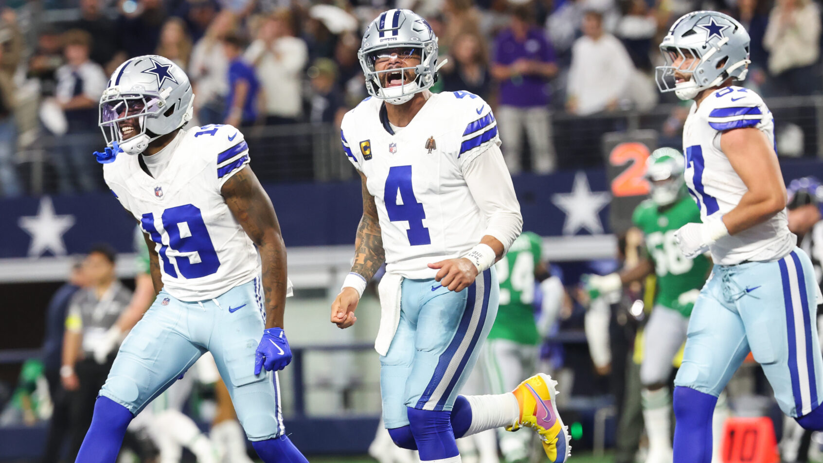 Dak Prescott and his teammates celebrate a Cowboys touchdown.