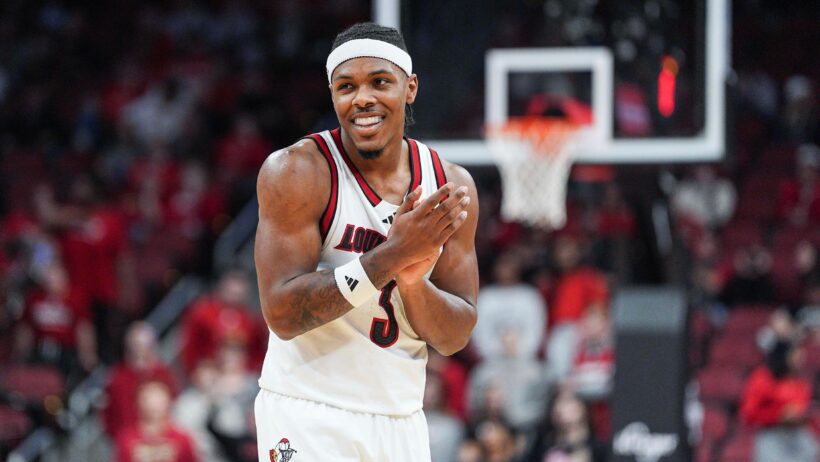 Louisville Cardinals guard Ryan Conwell smiling on the court