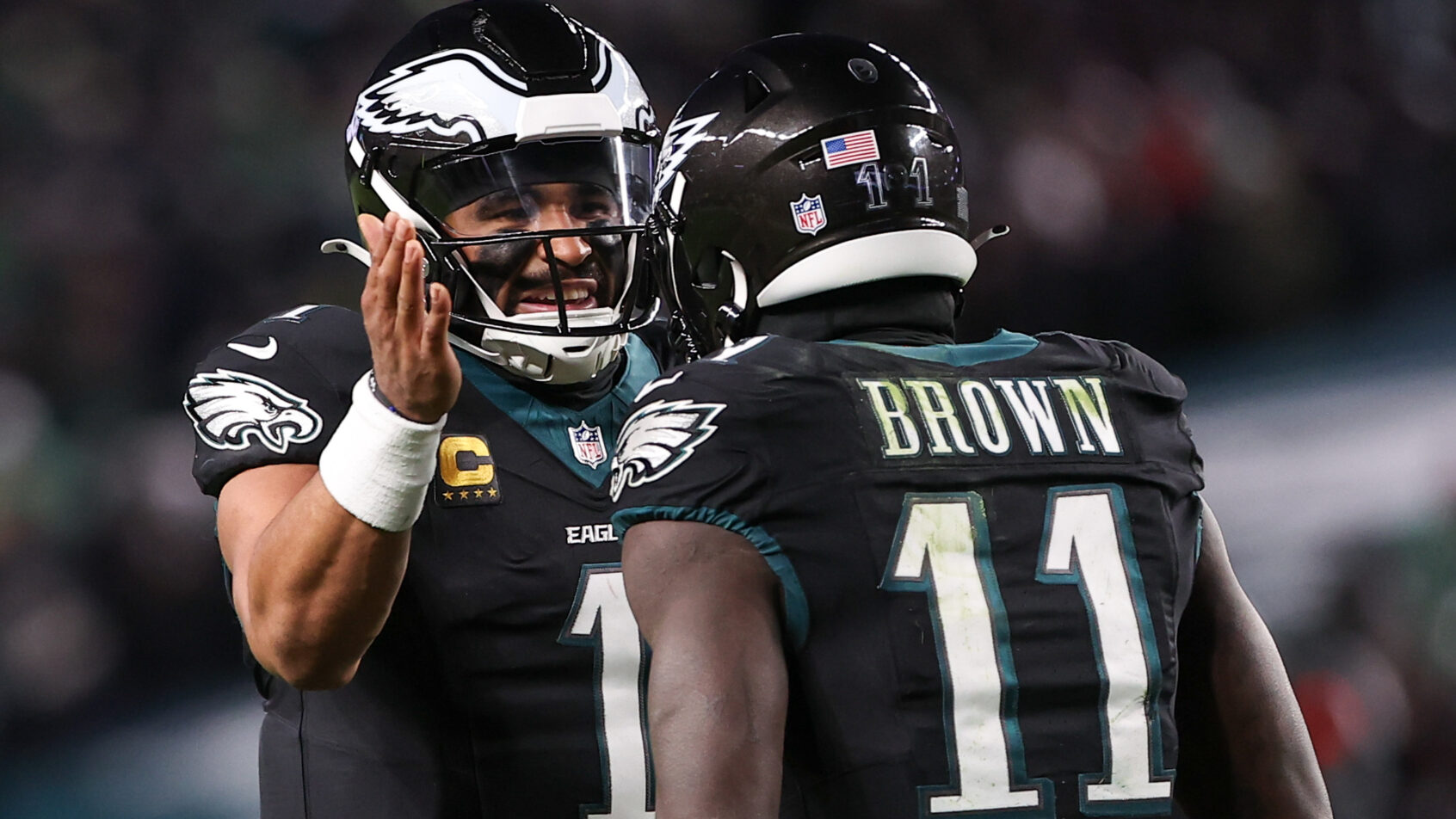 Jalen Hurts and A.J. Brown celebrate an Eagles touchdown.