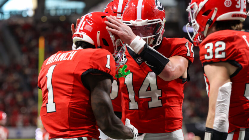 Gunner Stockton celebrates a TD with his Georgia teammates.
