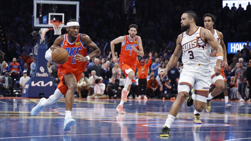 Oklahoma City Thunder guard Shai Gilgeous-Alexander dribbling up the court against the Phoenix Suns