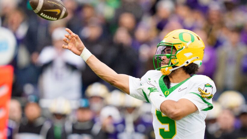 Oregon quarterback Dante Moore throwing the ball