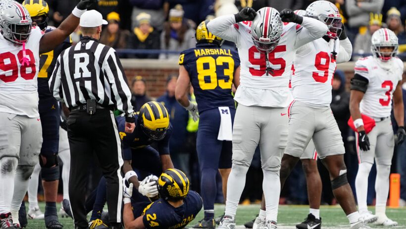 The Ohio State defense celebrates a stop versus Michigan.
