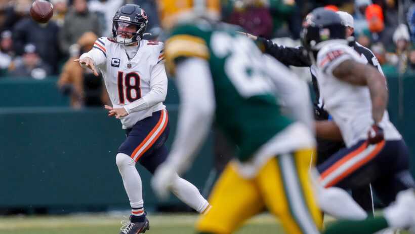 Chicago Bears quarterback Caleb Williams throwing a pass